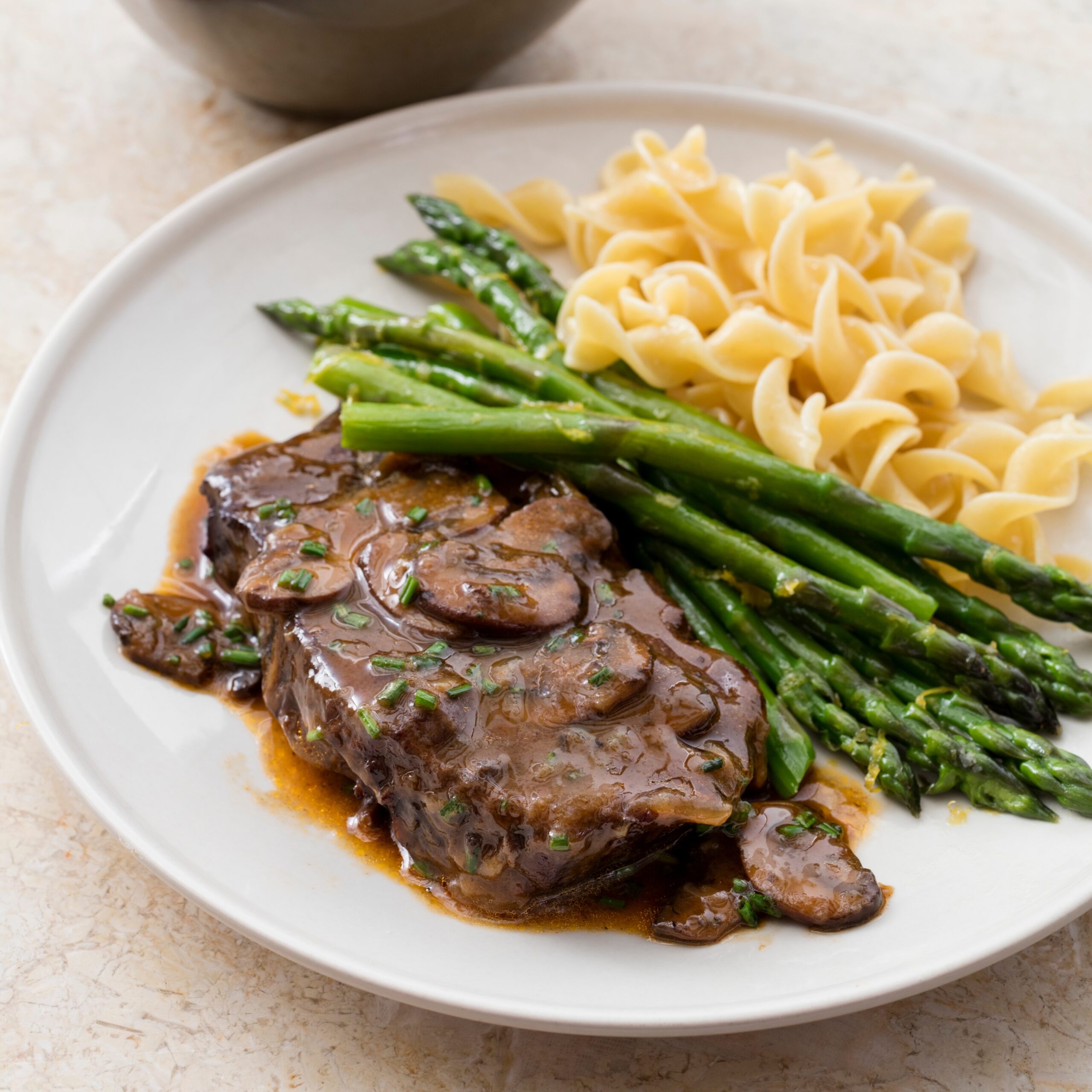 One Pot Braised Blade Steaks With Mushrooms Vidalias And Steamed Asparagus America s Test Kitchen Recipe