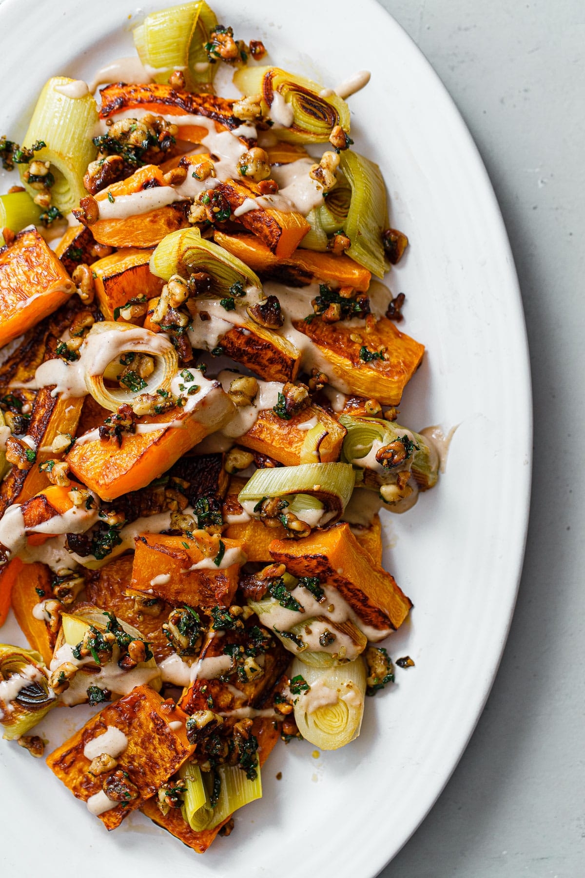 Roasted Butternut Squash And Leeks With Orange Tahini Sauce Walnuts And Za atar A Beautiful Plate